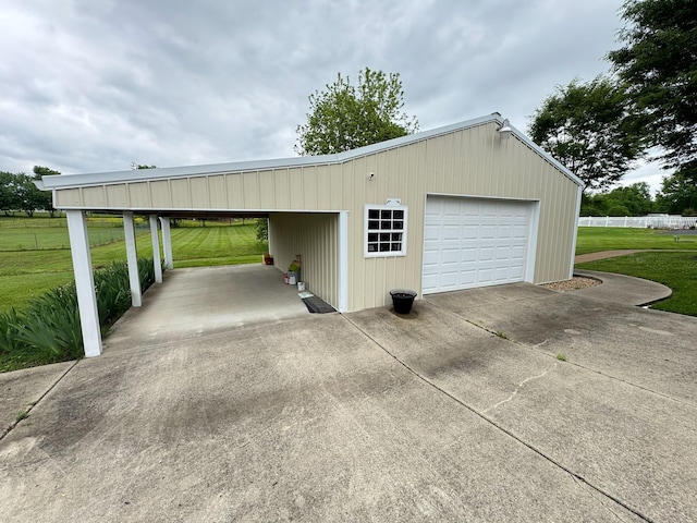 128 Mann Rd, Lebanon, TN 37087 - garage with concrete driveway and a detached garage