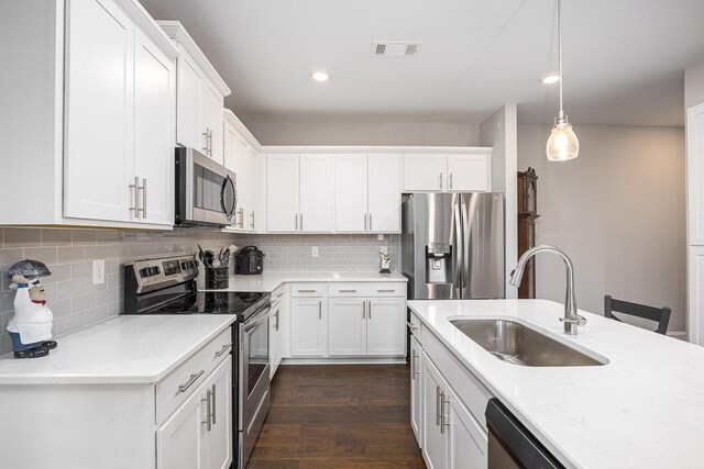 1901 Shadow Green Dr Unit 303, Franklin, TN 37064 - kitchen with stainless steel appliances, a sink, white cabinets, and recessed lighting