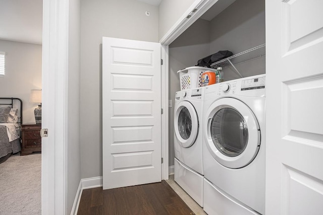 1901 Shadow Green Dr Unit 303, Franklin, TN 37064 - laundry area with separate washer and dryer, dark wood-type flooring, and baseboards
