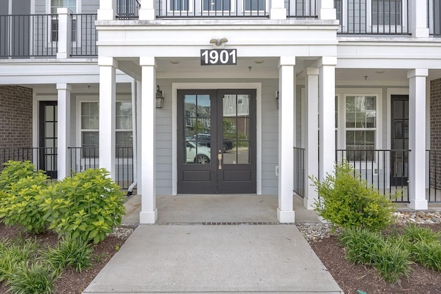 1901 Shadow Green Dr Unit 303, Franklin, TN 37064 - view of exterior entry with french doors, a balcony, and a porch