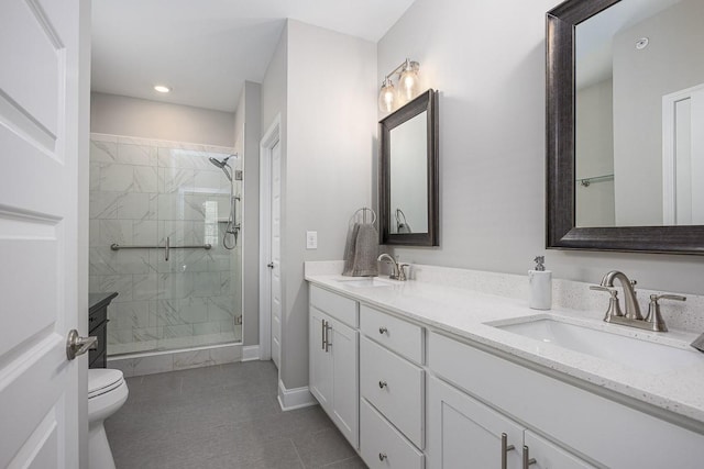 1901 Shadow Green Dr Unit 303, Franklin, TN 37064 - full bath with a marble finish shower, double vanity, toilet, tile patterned floors, and recessed lighting