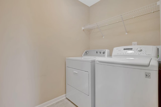 6001 Ten Bears Way, Spring Hill, TN 37174 - washroom with washing machine and dryer and baseboards