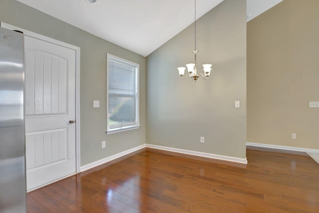 6001 Ten Bears Way, Spring Hill, TN 37174 - unfurnished dining area featuring a chandelier, hardwood / wood-style floors, lofted ceiling, and baseboards
