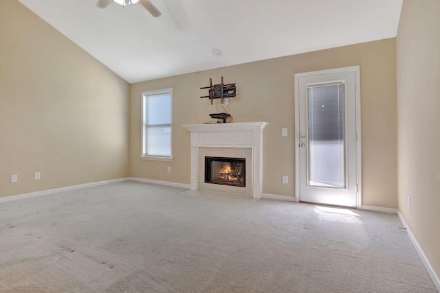 6001 Ten Bears Way, Spring Hill, TN 37174 - unfurnished living room featuring a ceiling fan, a premium fireplace, light colored carpet, baseboards, and lofted ceiling
