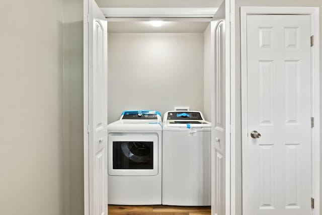 120 Johns St, La Vergne, TN 37086 - laundry room featuring washer and clothes dryer and wood finished floors