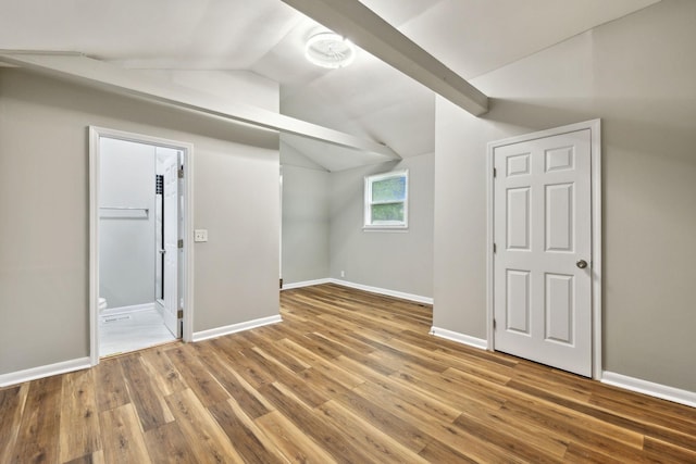 120 Johns St, La Vergne, TN 37086 - bonus room with vaulted ceiling, wood finished floors, and baseboards