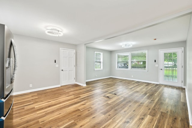 120 Johns St, La Vergne, TN 37086 - unfurnished living room with wood finished floors and baseboards