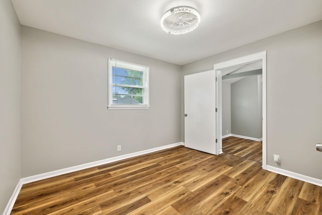 120 Johns St, La Vergne, TN 37086 - unfurnished bedroom with wood finished floors and baseboards