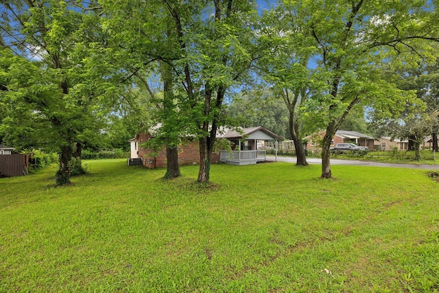 120 Johns St, La Vergne, TN 37086 - view of green lawn with driveway and cooling unit