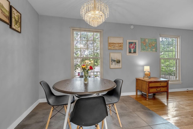1011 Murfreesboro Rd Unit L3, Franklin, TN 37064 - dining area featuring a chandelier, baseboards, and wood finished floors