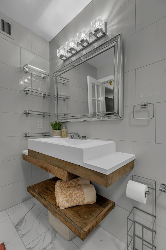 1011 Murfreesboro Rd Unit L3, Franklin, TN 37064 - bathroom featuring marble look tile flooring and vanity