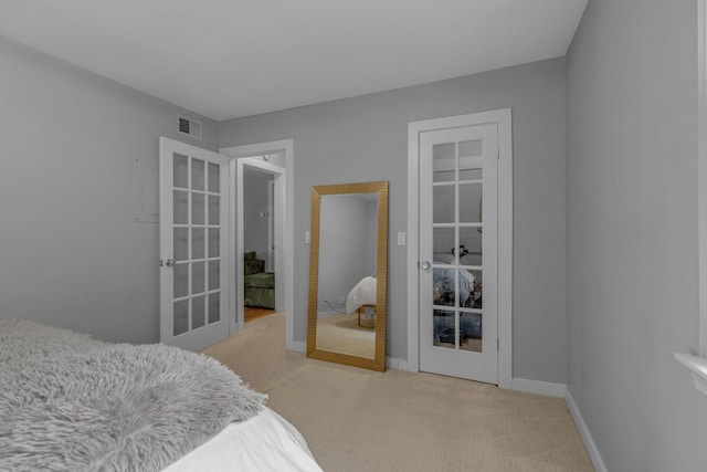 1011 Murfreesboro Rd Unit L3, Franklin, TN 37064 - bedroom featuring french doors, light colored carpet, and baseboards