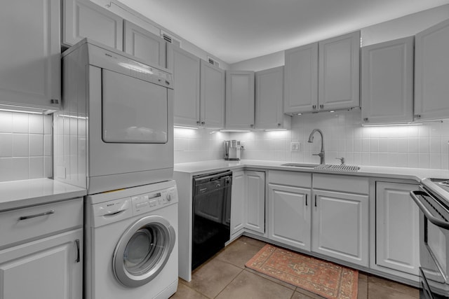 1011 Murfreesboro Rd Unit L3, Franklin, TN 37064 - laundry room with stacked washer and clothes dryer and light tile patterned flooring