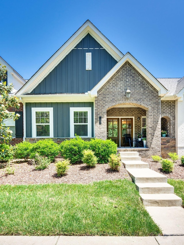 3023 Moultrie Cir, Franklin, TN 37064 - view of front of property featuring board and batten siding, brick siding, and a porch