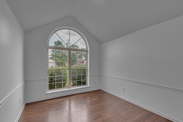 2240 Joann Dr, Spring Hill, TN 37174 - spare room with vaulted ceiling, wood finished floors, and baseboards