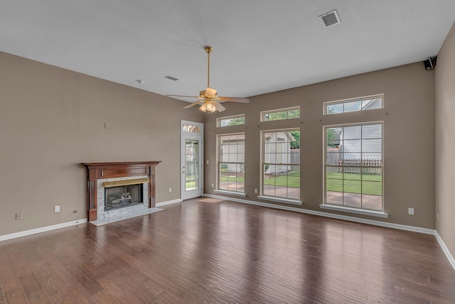 2240 Joann Dr, Spring Hill, TN 37174 - unfurnished living room featuring wood finished floors, ceiling fan, baseboards, and a fireplace