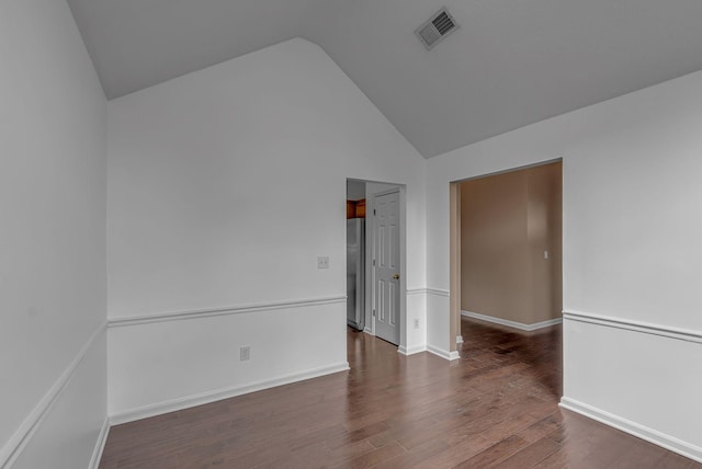 2240 Joann Dr, Spring Hill, TN 37174 - empty room with dark wood-type flooring, high vaulted ceiling, and baseboards