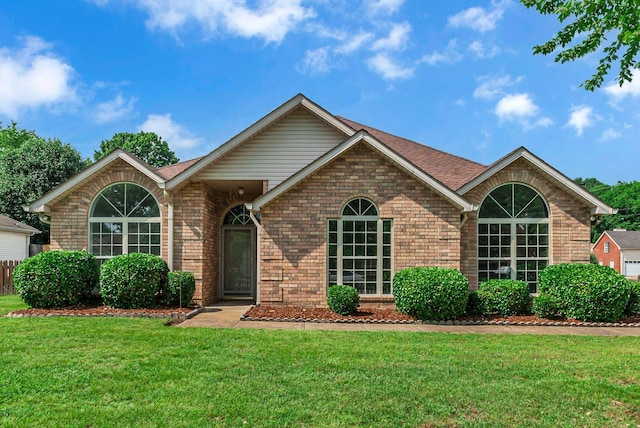 2240 Joann Dr, Spring Hill, TN 37174 - single story home featuring brick siding, a front lawn, and roof with shingles