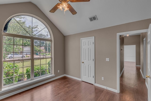 2240 Joann Dr, Spring Hill, TN 37174 - unfurnished bedroom with vaulted ceiling, dark wood-style floors, and baseboards