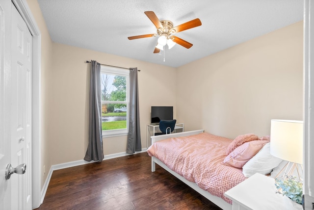 3387 Oak Park Dr, Clarksville, TN 37042 - bedroom with wood finished floors, a closet, baseboards, and a ceiling fan