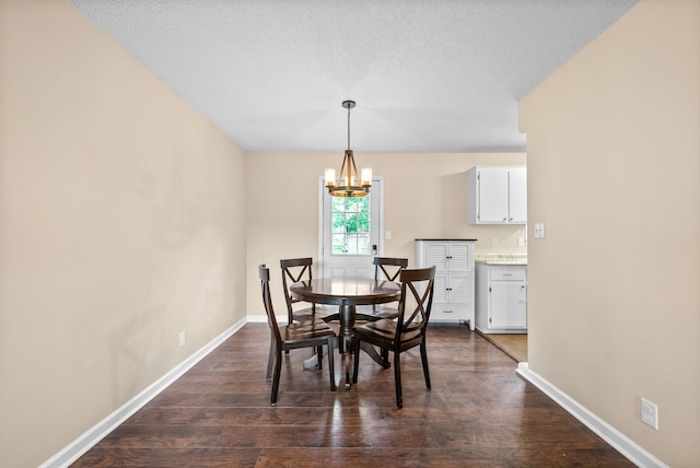 3387 Oak Park Dr, Clarksville, TN 37042 - dining space with a chandelier, baseboards, dark wood-style floors, and a textured ceiling