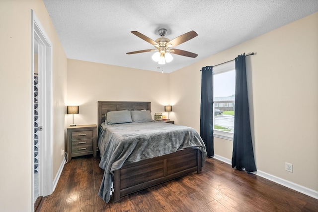 3387 Oak Park Dr, Clarksville, TN 37042 - bedroom featuring dark wood-style floors, baseboards, a textured ceiling, and a ceiling fan