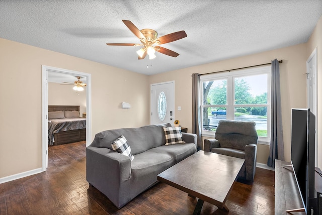 3387 Oak Park Dr, Clarksville, TN 37042 - living room with a ceiling fan, dark wood-style flooring, a textured ceiling, and baseboards
