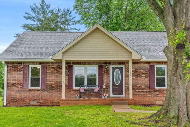3387 Oak Park Dr, Clarksville, TN 37042 - bungalow-style house with a shingled roof, brick siding, and a front lawn