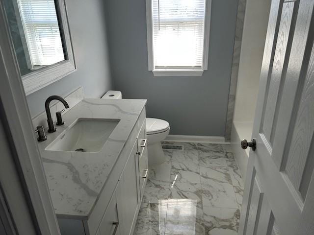 1047 Tylertown Rd, Clarksville, TN 37040 - bathroom with marble finish flooring, toilet, vanity, and baseboards