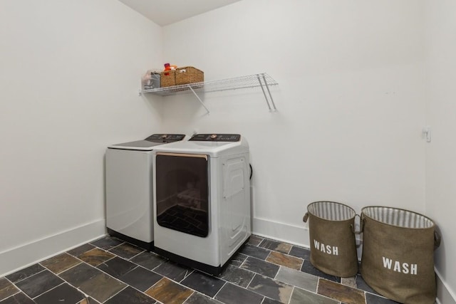 4034 Merryman Ln, Murfreesboro, TN 37127 - laundry room featuring separate washer and dryer, baseboards, and dark stone finish floors