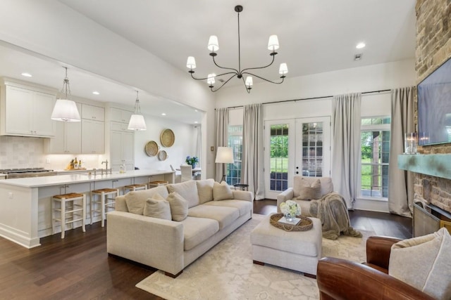4034 Merryman Ln, Murfreesboro, TN 37127 - living area featuring wood finished floors, recessed lighting, healthy amount of natural light, a chandelier, and a stone fireplace