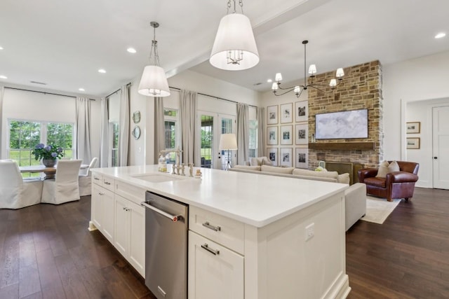 4034 Merryman Ln, Murfreesboro, TN 37127 - kitchen with dishwasher, a sink, open floor plan, dark wood-type flooring, and white cabinets