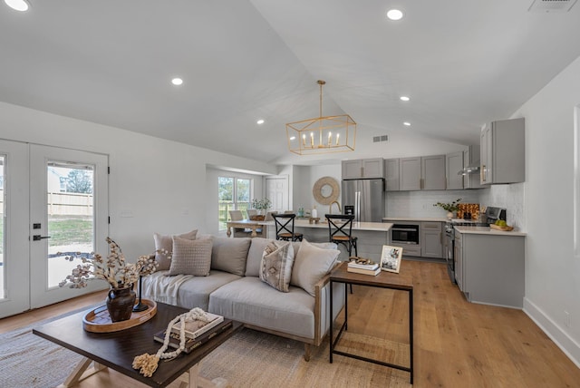 41 Trice Rd, Lebanon, TN 37087 - living area featuring light wood-style floors, a chandelier, recessed lighting, lofted ceiling, and baseboards