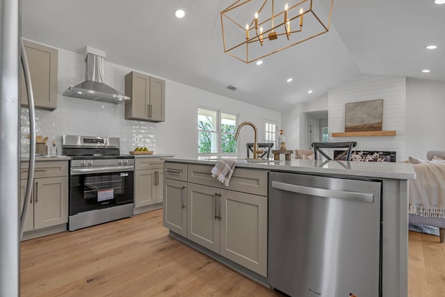 41 Trice Rd, Lebanon, TN 37087 - kitchen with stainless steel appliances, wall chimney range hood, gray cabinetry, vaulted ceiling, and light countertops