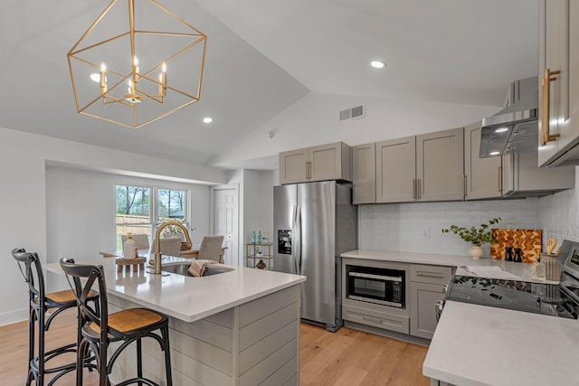 41 Trice Rd, Lebanon, TN 37087 - kitchen with appliances with stainless steel finishes, a sink, gray cabinetry, light countertops, and vaulted ceiling