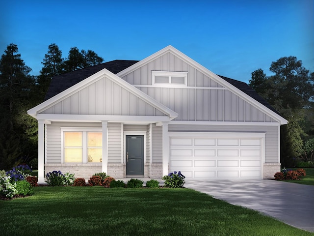 1345 Beasley Blvd, Mount Juliet, TN 37122 - view of front of house with board and batten siding, brick siding, driveway, a front yard, and a garage