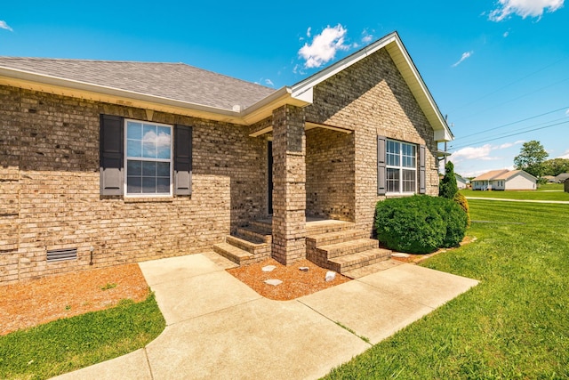 103 Alice Smith Dr, Portland, TN 37148 - view of front facade with a front yard, brick siding, and roof with shingles