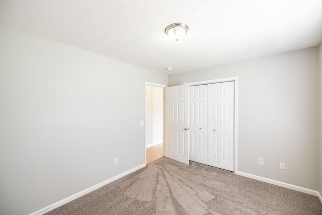103 Alice Smith Dr, Portland, TN 37148 - unfurnished bedroom with carpet flooring, baseboards, and a closet