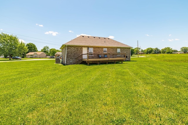 103 Alice Smith Dr, Portland, TN 37148 - rear view of house with brick siding, a yard, and a deck