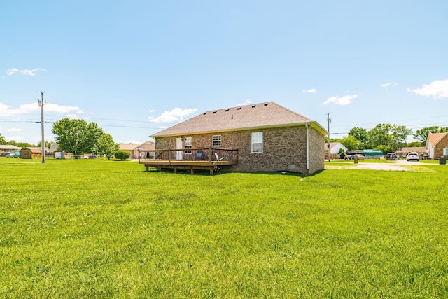 103 Alice Smith Dr, Portland, TN 37148 - back of property featuring a wooden deck, a yard, and brick siding
