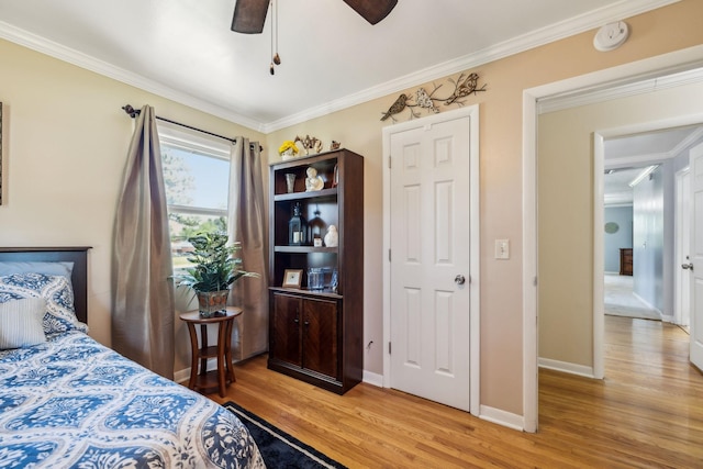 101 Townview Dr, Smyrna, TN 37167 - bedroom featuring light wood-style floors, crown molding, baseboards, and a ceiling fan