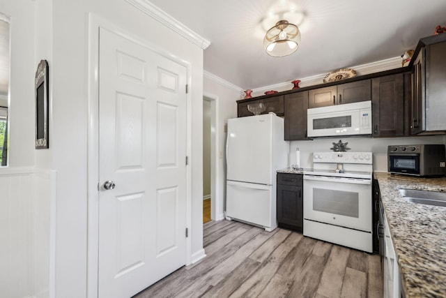 101 Townview Dr, Smyrna, TN 37167 - kitchen featuring white appliances, dark brown cabinetry, ornamental molding, light wood-type flooring, and light stone countertops