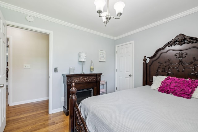 101 Townview Dr, Smyrna, TN 37167 - bedroom with light wood finished floors, baseboards, a chandelier, and ornamental molding