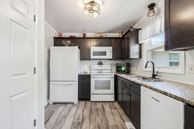 101 Townview Dr, Smyrna, TN 37167 - kitchen featuring white appliances, a sink, crown molding, dark brown cabinets, and light wood-type flooring