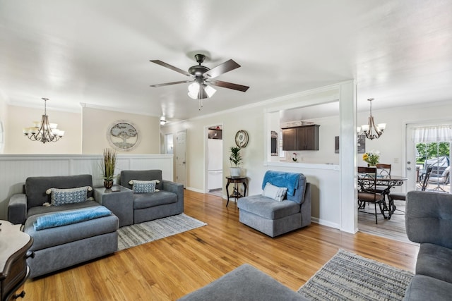 101 Townview Dr, Smyrna, TN 37167 - living area featuring a chandelier, light wood finished floors, ornamental molding, and a ceiling fan