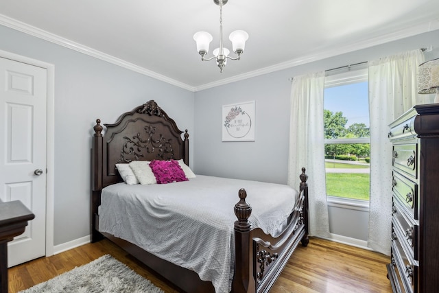 101 Townview Dr, Smyrna, TN 37167 - bedroom with a chandelier, baseboards, ornamental molding, and wood finished floors