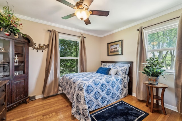 101 Townview Dr, Smyrna, TN 37167 - bedroom with light wood-style flooring, crown molding, baseboards, and a ceiling fan