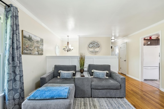 101 Townview Dr, Smyrna, TN 37167 - living area with ornamental molding, wood finished floors, a chandelier, and baseboards