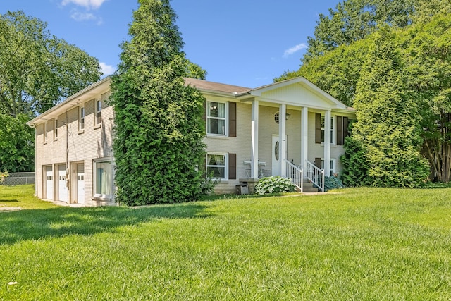 101 Townview Dr, Smyrna, TN 37167 - greek revival inspired property featuring an attached garage, brick siding, and a front yard