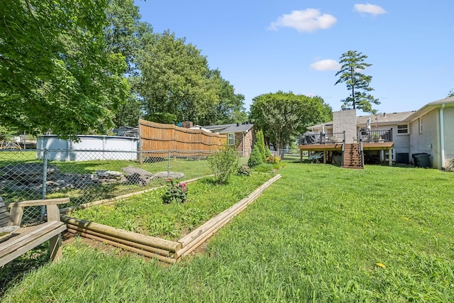 101 Townview Dr, Smyrna, TN 37167 - view of yard featuring stairs, a wooden deck, and a vegetable garden